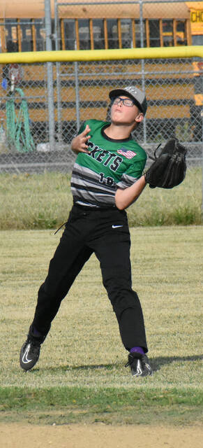 Logan Grossnickle of the Fayetteville Rockets makes a catch in the outfield July 12, 2023, against the New Richmond River Rats in the Class B Junior East Region Knothole Baseball playoffs at Mt. Orab.