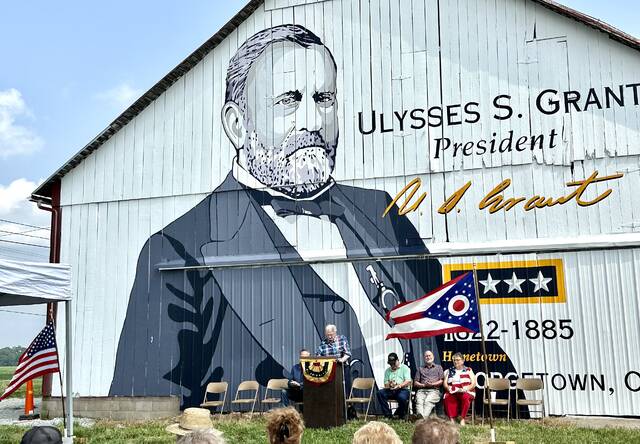 A crowd gathered for the dedication of the new U.S. Grant barn painting located on State Route 125 between Georgetown and Hamersville on the property of Kenneth Waterfield. Photo by Wade Linville