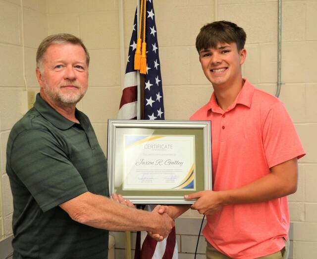 At the ABCAP Board of Trustees annual meeting held June 20, Tony Applegate (board chairman) presented Jaxon Galley with a scholarship certificate. Photo provided