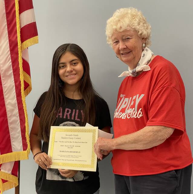 Ripley-Union-Lewis-Huntington Middle School student, Marleana Highfield is presented with a certificate for winning the Ohio GFWC State Essay Contest. Presenting the certificate is essay chairman Carol Stivers.