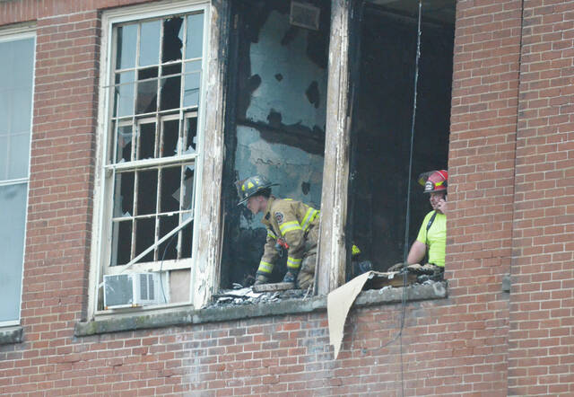 Members of the Ripley Fire Department and local emergency response crews worked fast to evacuate residents and extinguish the fire at the Ripley Schoolhouse Apartments on Aug. 17. Photo by Wade Linville