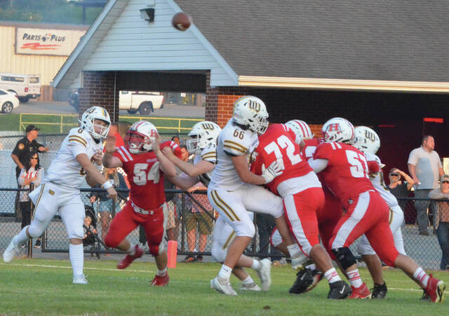 Western Browns Brady Shotgun Sutton completes a pass during the Broncos week one win against Hillsboro. Photo by Wade Linville