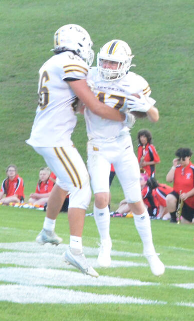 Western Browns Damion Valdez and Brayden Harmon celebrate a Bronco touchdown in the week one win over Hillsboro. Photo by Wade Linville