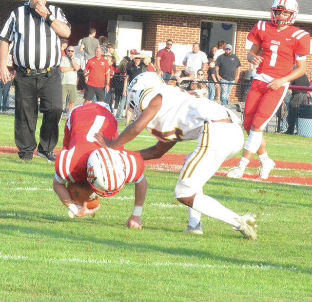 Western Browns Lamar Hall takes down a Hillsboro ball-carrier during the Broncos week one win. Photo by Wade Linville