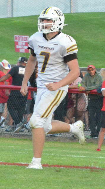 Western Brown defender Tye Spaulding marches off field after grabbing an interception in the Broncos week one win over Hillsboro. Photo by Wade Linville