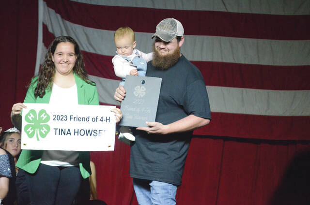 OSU Extension Educator presents the Friend of the 4-H Award to Tina Howser. Receiving the award on behalf of Howser was her son, Jesse. Photo by Wade Linville