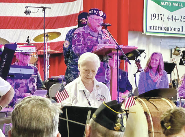 Chaplain Bill Graybill (U.S. Army) leads the way in prayer during the Brown County Fair Veterans Recognition Service held Sept. 28. Photo by Wade Linville