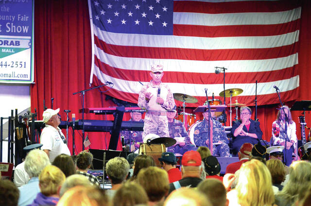 Colonel Dan Bubp (U.S.M.C.R. ret.) speaks to the crowd during the Brown County Fair Veterans Recognition Service held Sept. 28. Photo by Wade Linville
