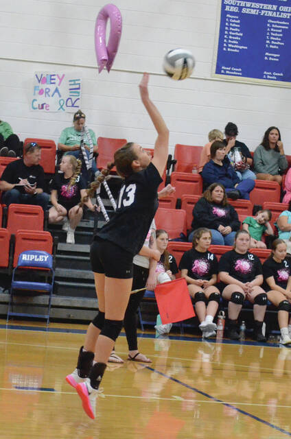 Fayettevilles Ainsley Beckler delivers a serve in the Volley for the Cure match at Ripley on Oct. 4. Photo by Wade Linville