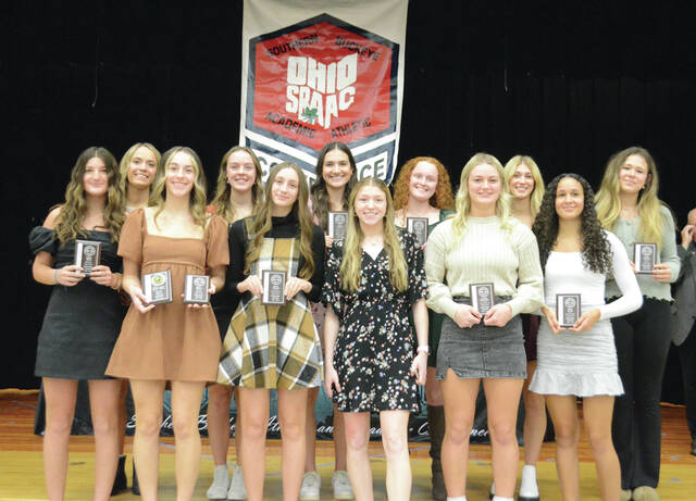 The 2023 Southern Buckeye Athletic/Academic Conference American Division First Team of volleyball all-stars pose with their awards. Front row, from the left, Brynn Bryant (Wilmington), Lisbon Smith (Wilmington), Olivia Fischer (Western Brown), Alyssa Campbell (Western Brown), Cassidy Armstrong (Western Brown), and Piper Willis (New Richmond); back row, Shelby Henry (New Richmond), Ella Helden (New Richmond), Cate Coulter (New Richmond), Macee Steele (Goshen), Natalie Hillman (Clinton-Massie), and Ellie Poynter (Batavia). Photo by Wade Linville