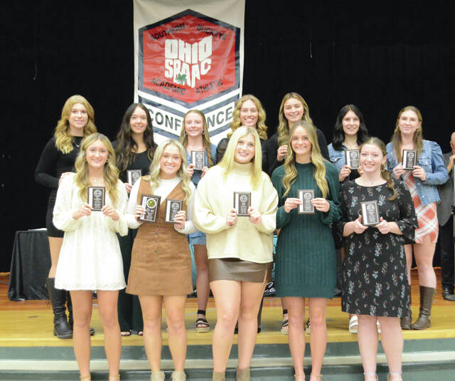 The 2023 Southern Buckeye Athletic/Academic Conference National Division First Team of volleyball all-stars pose with their awards. Front row, from the left, Ella Sunderman (Williamsburg), Madison Speeg (Williamsburg), Avery Neth (Williamsburg), Lauren Runyon (East Clinton), and Cheyenne Reed (East Clinton); Karsyn Jamison (East Clinton), Sydney Norton (Clermont Northeastern), Jenna Brown (Clermont Northeastern), Bella Bosley (Clermont Northeastern), Mya Amann (Clermont Northeastern), Hope Blankenbeckler (Blanchester), and Desiree Abbott (Blanchester). Photo by Wade Linville