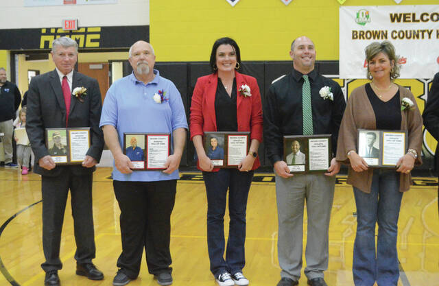 Five individuals were among those inducted into the Brown County Athletic Hall of Fame on Dec. 28 during the Brown County Holiday Basketball Tournament at Georgetown High School. The new inductees included (from the left): Jim Neu, Joe Huff, Kerri Andrews-Petrillo, Jason Iles, and accepting the award on behalf of David Miller was Christy Lucas. Photo by Wade Linville