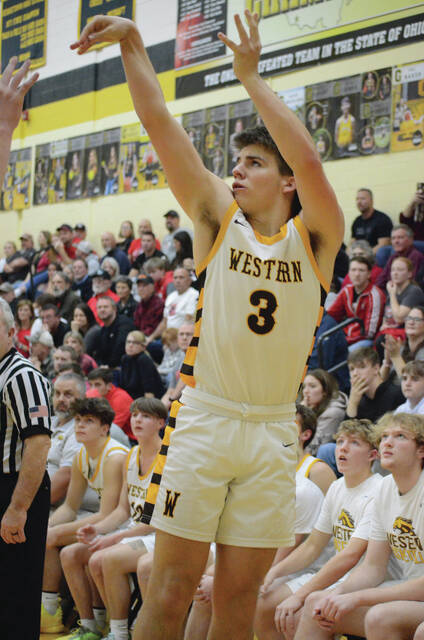 Western Browns Jet Jamison fires off a shot from three-point range during the 2023 Brown County Holiday Tournament championship game against Eastern on Dec. 29. Photo by Wade Linville