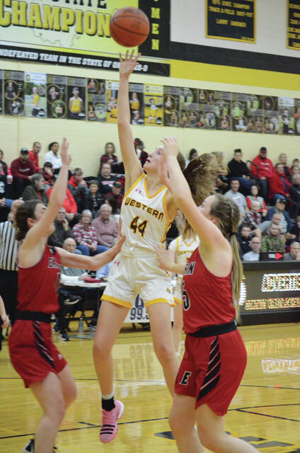 Western Browns Olivia Fischer goes up for a score over Eastern defenders in the Brown County Holiday Tournament varsity girls championship game on Dec. 29. Photo by Wade Linville