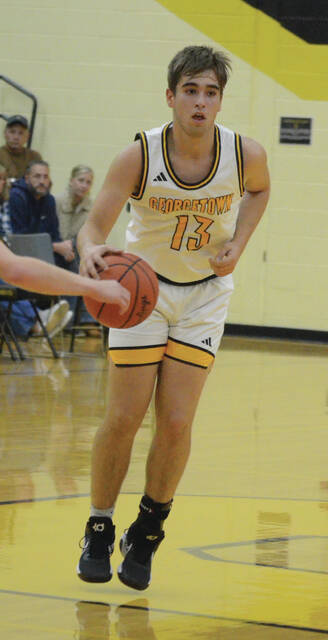 Georgetown junior Austin Miles brings the ball down the court during a game this season. Photo by Wade Linville