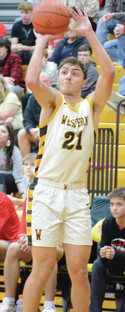 Western Brown senior Abe Crall fired for 15 points and pulled down 13 rebounds in a double-double performance against New Richmond on Jan. 16. Above, Crall buries a shot during a game this season. Photo by Wade Linville