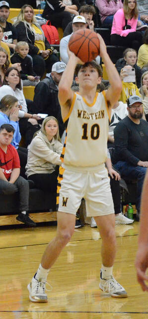 Western Browns Isaiah Smith shoots from three-point range during a Bronco win this season. Photo by Wade Linville