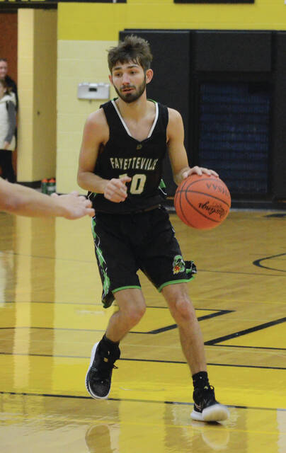 The Fayetteville-Perry Rockets stood at an overall record of 11-10 at the time of the tournament draw, and as the No. 3 seed they will take on No. 11 seed Middletown Christian (3-16) in round one of the Southwest District Division IV Sectional Tournament at Ross High School on Feb. 27. Above, Fayettevilles Caleb Tippis heads the point of the Rocket offense during a game this season. Photo by Wade Linville