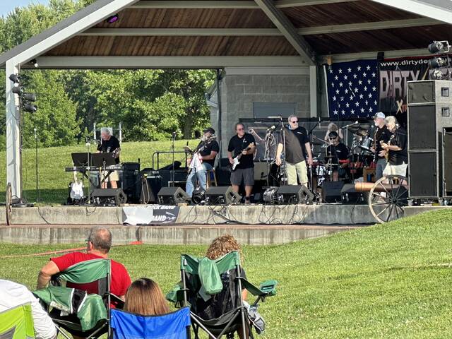 Dirty Deeds (AC/DC tribute band) performs for the large crowd during the first Mt. Orab Music in the Park concert of 2024 on May 11. Photo by Wade Linville
