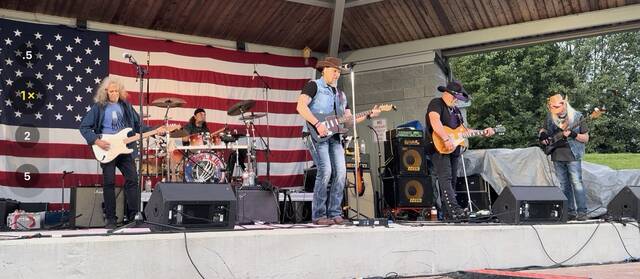 Turn It Up (Lynyrd Skynyrd tribute band) performs for the crowd during the June 1 Mt. Orab Music in the Park. Photo by Wade Linville