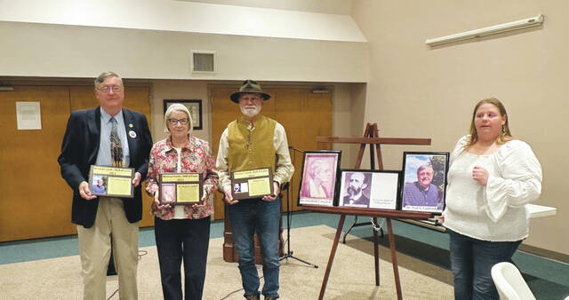 Four new members were inducted into the Brown County History Hall of Fame during a ceremony hosted by the Brown County Historical Society Oct. 24. From the left, are 2024 inductee Dr. Ned Lodwick, Betty Campbell (holding the plaque for 2024 inductee Dr. Elizabeth Campbell), Mike McQueary (holding the plaque for 2024 inductees William Dixon and Cornelius Washburn), and Brown County Historical Society President Susan Bell. Photo by Wade Linville