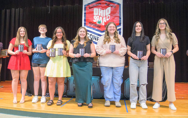 The 2024-25 Southern Buckeye Athletic/Academic Conference American Division First Team of girls bowling all-stars pose with their awards. From the left, Izzy Rhoads (Wilmington), Mackenzie Pyle (Wilmington), Kylie Fisher (Wilmington), Kiley Comberger (Wilmington), Lily Holder (Western Brown), Jacelyn Lawson (Clinton-Massie), and Heaven Clark (Batavia). Photo by Jake Dowling/Clermont Sun