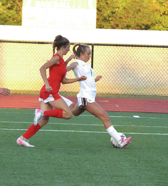 Western Browns Kendall Hanlon fires for one of her four goals in the Lady Broncos Sept. 15 win at Hillsboro. Photo by Wade Linville