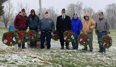 The first Wreaths Across America Day event was held at Decatur Cemetery on Saturday, Dec. 13 with the eight ceremonial wreaths placed near the cemetery flagpole. From the left, Philip Dotson, Dean Dotson, Jeff Puckett, Eddie Bailey, Rebecca Rickey, Kevin Jodrey and Gary Embrey. Photo provided