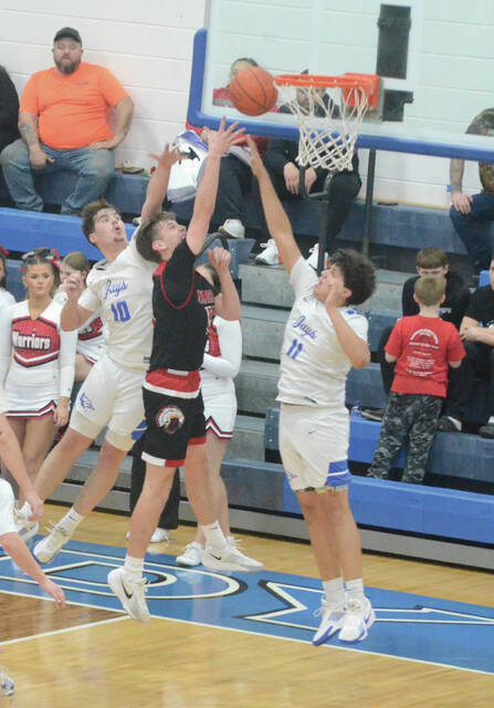 Easterns Chase Pinkerton goes up for a shot over Ripley defenders during the Warriors Feb. 19 win. Photo by Wade Linville