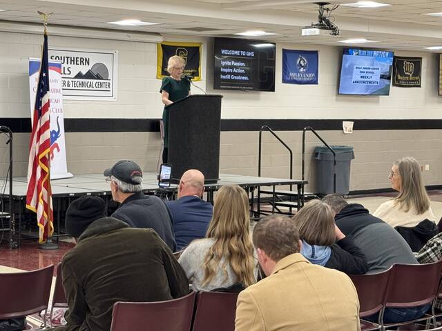 Kelly Faas, of the Brown County Conservative Republican Womens Club, welcomes the crowd to the Meet the Candidates event held March 18 at Southern Hills Career and Technical Center in Georgetown. Photo by Wade Linville