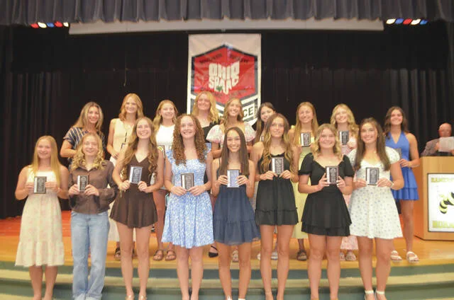 The 2026 Southern Buckeye Athletic/Academic Conference National Division First Team of girls track and field all-stars pose with their awards. Front row, from the left, Savannah Wahl (Williamsburg), Claire Moore (Williamsburg), Peyton Jones (Williamsburg), Cailee Johnson (Williamsburg), Kiera Gregory (Williamsburg), Brooklynn Gibson (Williamsburg), Makinley Fishback (Williamsburg), Emily Earley (Williamsburg), and Emily Earley (Williamsburg); back row, Reddyn Cleaver (Williamsburg), Lyla Ayers (Williamsburg), Allie Tolle (Georgetown), Lydia Johnson (Georgetown), Cinder Shaw (Clermont Northeastern), Paige Donaldson (Clermont Northeastern), Julia Best (Clermont Northeastern), Rileigh Ashley (Clermont Northeastern), and Addison Elam (Blanchester). Photo by Wade Linville