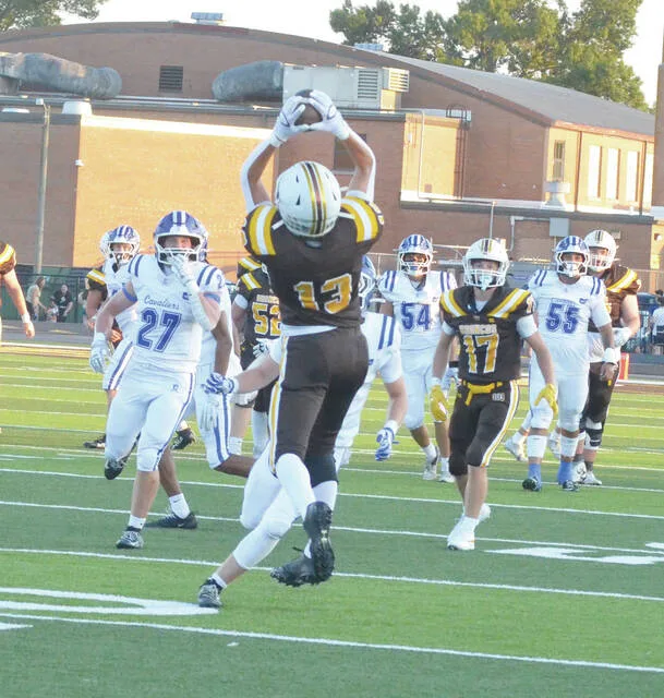 Western Browns Michael Andrews pulls down a reception in the Broncos week three battle against Chillicothe. Photo by Wade Linville