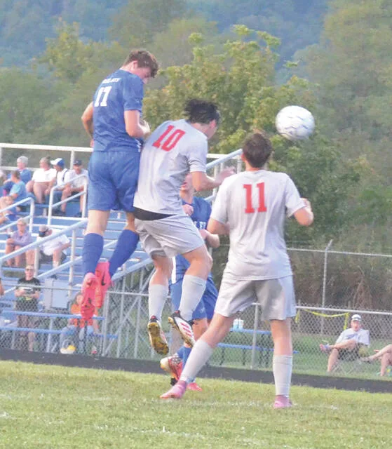 Ripleys Cash Bolar goes up for a header shot during the Blue Jays Sept. 11 game against Glenwood New Boston. Photo by Wade Linville